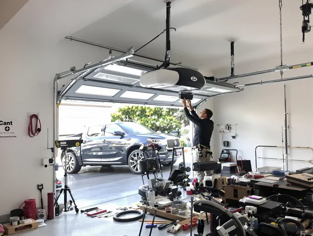 Willimantic Garage Door Repair specialist installing smart garage door opener system in Willimantic home