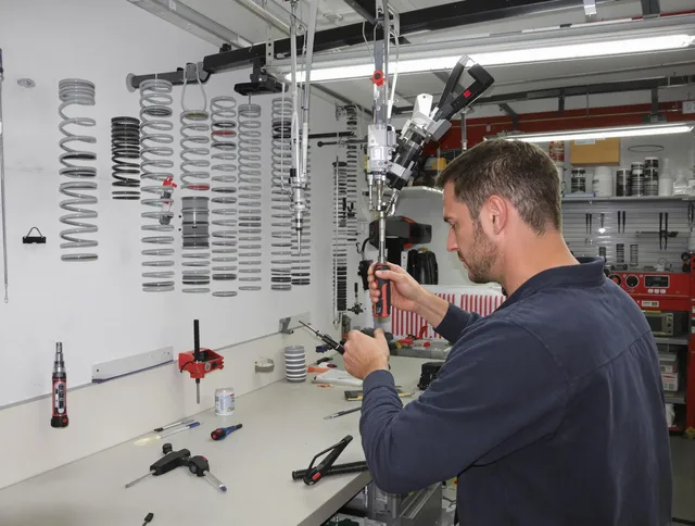 Willimantic Garage Door Repair safety certified technician performing precision spring replacement in Willimantic