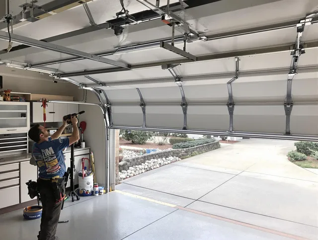 Garage door track repair service by Willimantic Garage Door Repair in Willimantic